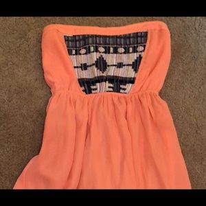 Strapless top with sheer back and lace trim cover